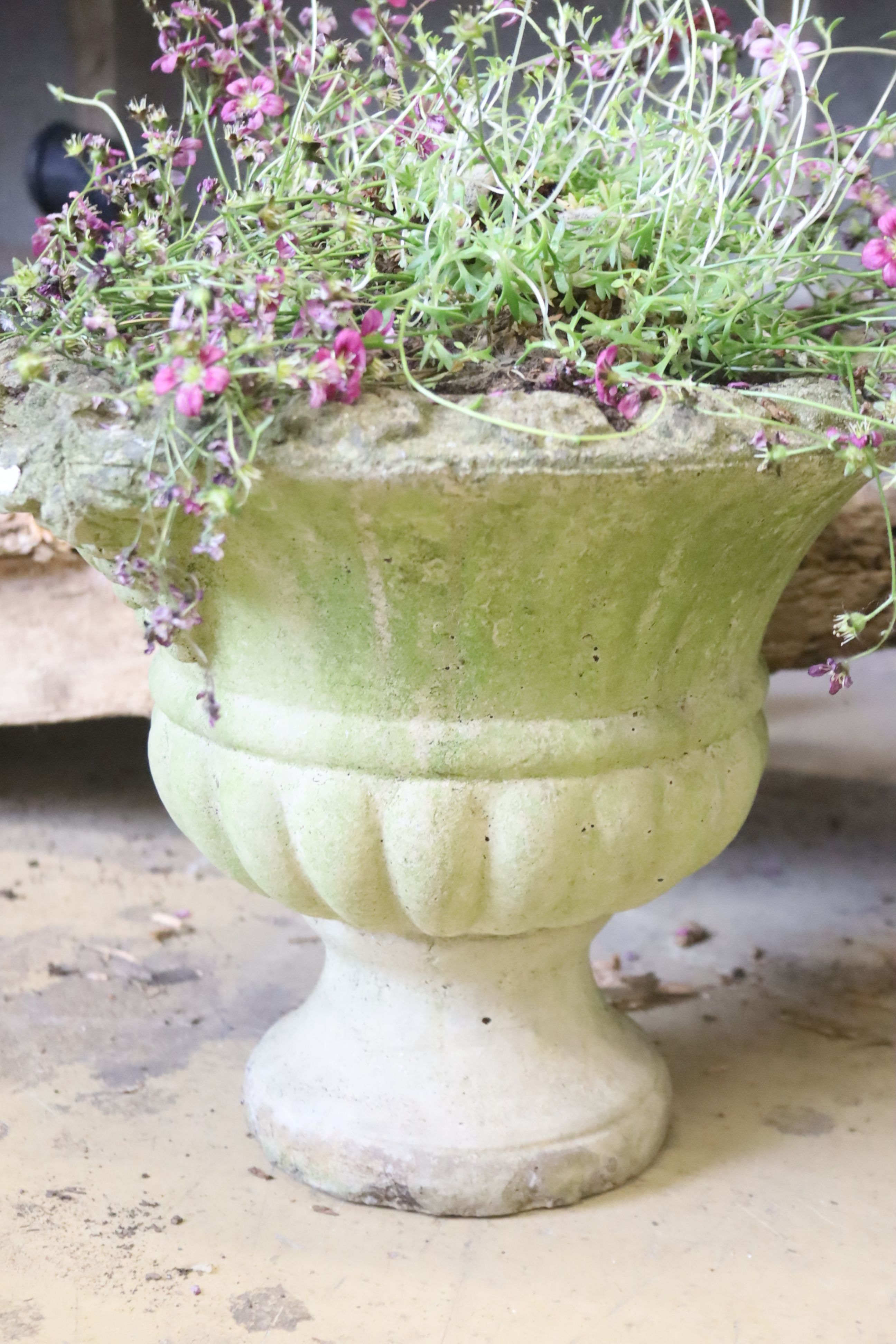 A pair of reconstituted garden planters, 30cm diameter, height 26cm